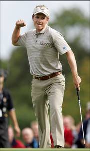 Europe's Luke Donald reacts after making a putt on the fifth green. Donald and partner Sergio Garcia won their foursome match Friday at the Ryder Cup in Straffan, Ireland.