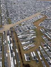 Some of the nearly 10,000 FEMA mobile homes sit at the Hope, Ark., airport in this Feb. 24, 2006, file photo. A provision of the homeland security spending bill approved by Congress last week allows FEMA to sell or donate the trailers to municipalities, nonprofit groups or American Indian tribes.