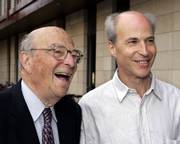 Nobel laureate Arthur Kornberg, left, smiles with his son Roger D. Kornberg, of Stanford University, who won the Nobel Prize in chemistry Wednesday. He was awarded the prize for his studies of how cells take information from genes to produce proteins, a process that could provide insight into defeating cancer and advancing stem cell research. Arthur Kornberg shared the 1959 Nobel medicine prize with Severo Ochoa, for their studies of how genetic information is transferred from one DNA molecule to another.