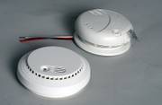 Two examples of smoke detectors are photoelectric, top, and ionization. Photoelectric smoke detectors are hard-wired into a home and are better at sensing smoldering fires. Ionization smoke detectors usually run on 9-volt batteries and better sense flaming fires.