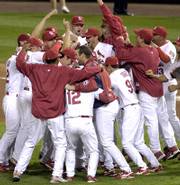 The Cardinals celebrate after beating the San Diego Padres in Game 4 of the National League Division Series. St. Louis won, 6-2, on Sunday in St. Louis.