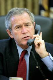 President Bush speaks with Chinese President Hu Jintao on Monday. Bush called North Korea&squot;s nuclear test "a threat to international peace and security."