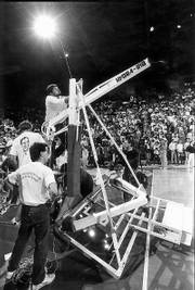 Workers had to replace the backboard after Alonzo Jamison's violent dunk during the 1988 Late Night.