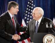 U.S. Rep. Jim Ryun, R-2nd District, welcomes Vice President Dick Cheney to the stage during a fundraiser for Ryun Thursday in Topeka.