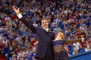Sasha Kaun and his dance partner Andrea Hill bow to the crowd following the men's basketball team skits at Late Night at Allen Fieldhouse in 2006.