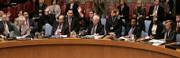 U.N. Security Council representatives raise their hands in a unanimous vote Saturday in support of a resolution to impose punishing sanctions on North Korea for its claimed nuclear test, declaring that its action posed "a clear threat to international peace and security."