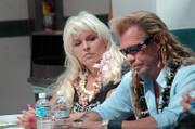 Duane ''Dog'' Chapman, right, and his wife, Beth, hold a news conference Friday in Honolulu. Attorneys for Chapman say that they've been granted an injunction by Mexican authorities while they investigate the criminal charges against their client.