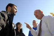 During a visit to Lawrence, attorney general candidate Paul Morrison, right, visited with, from left, Kansas University graduate students Russell Miller, Leavenworth, and Elaine Elliott, Nortonville, and KU alumnus Mike Peterson. The group was outside Wescoe Hall on Monday.