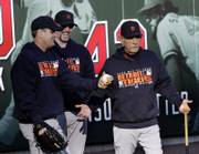 Detroit manager Jim Leyland, right, gestures as he jokes with pitchers Kenny Rogers, left, and Nate Robertson. Robertson will start for the Tigers in tonight's Game 3 of the World Series.