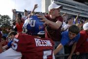 Kansas fans congratulate freshman QB Todd Reesing after he sparked the Jayhawks past Colorado. Reesing finished with 106 passing yards and 90 rushing yards.