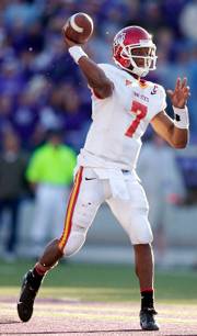 Iowa State quarterback Bret Meyer throws to a receiver during the second half of last week's loss to Kansas State. Meyer is one of the few healthy ISU skill-position players heading into today's game with Kansas.