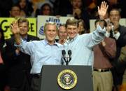 President Bush and U.S. Rep. Jim Ryun enjoy cheers from a Republican crowd at the Kansas Expocentre. The president stopped Sunday in Topeka to endorse Ryun and encourage voters to support other GOP candidates in Kansas in Tuesday's election.