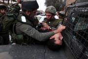 Israeli Border Police officers detain a Palestinian Monday at a temporary checkpoint in the West Bank town of Hebron. The latest round of talks involving Palestinian leaders moved ahead despite an Israeli offensive in northern Gaza border, aimed at halting Palestinian rocket fire on Israeli communities near the coastal strip.