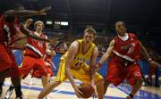 Kansas University signee COLE ALDRICH (in yellow) heads for the basket during the Jayhawk Invitational Basketball Tournament in Allen Fieldhouse. Aldrich signed his letter of intent Wednesday to join the KU men's basketball program next year.