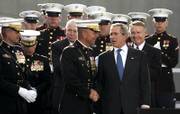 President Bush shakes hands with Gen. Michael Hagee, the Marine commandant, after a dedication ceremony Friday for the National Museum of the Marine Corps in Triangle, Va.
