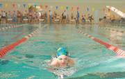 Anna McCurdy competes in the first heat of the 10- and- under 100-yard breaststroke during the Lawrence IMX Challenge 2006 Saturday at the Lawrence Indoor Aquatic Center.