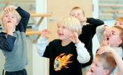 FROM LEFT, Adam Sampson, 6, and Rowan Laufer rehearse with other castmates in a scene from "The Snow Queen." The show will open Dec. 8 at the Lawrence Arts Center, 940 N.H.