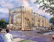 A development group led by Jeff Schmalberg and Martin Moore proposes a four-story library building at the southwest corner of Ninth and New Hampshire streets.