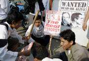 Members of an Indonesian Muslim group prepare signs for a protest against a visit by U.S. President George W. Bush today in Bogor, Indonesia. Muslim and student groups have said they will attempt to disrupt the meeting between Bush and Indonesian President Susilo Bambang Yudhoyono.