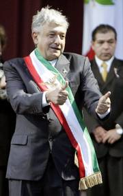 Former Mexican presidential candidate Andres Manuel Lopez Obrador was sworn in Monday as the country&squot;s "legitimate" president in front of thousands of supporters at the Zocalo plaza in Mexico City. After narrowly losing the country&squot;s July 2 elections to President-elect Felipe Calderon, Lopez Obrador has vowed to continue with his parallel government.