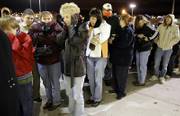 Shoppers line up in subfreezing temperatures as they wait for the Kohl's department store to open at 5 a.m. Nov. 25, 2005, in Omaha, Neb. These days, heading to a store at 5 a.m. the day after Thanksgiving is for wimps. A growing number of the nation's stores and malls are opening at midnight on what is known as Black Friday. And some stores like CompUSA and B.J.'s are opening on Thanksgiving Day to give shoppers a head start on their holiday shopping.