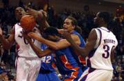 Kansas forwards Julian wright, right, and Darrell Arthur, left, battle for a rebound with Florida's Corey Brewer and Joakim Noah. Wright was named MVP of the Las Vegas Invitational after the Jayhawks' 82-80 overtime victory against No. 1 Florida on Saturday.
