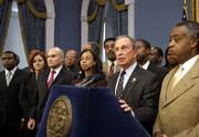 New York City Police Chief Raymond Kelly, third from left, and the Rev. Al Sharpton, right, join other community leaders as New York City Mayor Michael Bloomberg, center, speaks to reporters in the Blue Room at City Hall in New York City on Monday. Bloomberg and Kelly met with community leaders in the wake of the weekend shooting death of Sean Bell, an unarmed bridegroom who was gunned down by undercover police officers.
