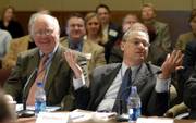 Peter Brown, of the Polling Institute at Quinnipiac University in Connecticut, right, responds to a question during the 2006 Post-Election Conference Friday at the Dole Institute of Politics. The panelist at left is Ray Strother, Democratic strategist with Strother-Duffy-Strother.