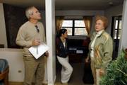 Gady Tene, of Omaha, Neb., left and his daughter, Shiri Tene, a student at Kansas University, look over an apartment in Lawrence as real estate agent Jean Collins stands by to answer questions. Gady Tene wants to buy a place both as an investment and for his daughter to live in while at KU.