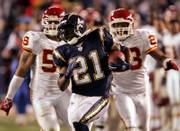 San Diego running back LaDainian tomlinson (21) leaves Kansas City's Derrick Johnson, left, and Patrick Surtain in his wake as he races 85 yards for his second touchdown. Tomlinson scored two touchdowns in the Chargers' 20-9 victory Sunday night in San Diego.