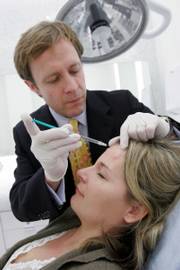 Dr. Jeffrey M. Kenkel gives patient Amy Andrade, 32, of Dallas, a Botox treatment. Medical spas like this one at Dallas' NorthPark Center are seeing rapid growth. The number in the United States has jumped from 50 in 2002, when Botox injections were approved, to about 2,500 this year.