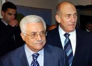 Israeli Prime Minister Ehud Olmert, right, walks with Palestinian Authority President Mahmoud Abbas, also known as Abu Mazen, prior to a meeting at Olmert's official residence in Jerusalem on Saturday. Olmert and Abbas were in a long-overdue summit Saturday, reviving hopes that peace talks can resume after years of fighting, hostility and distrust.