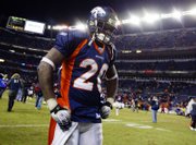 Denver broncos running back mike bell hangs his head as he walks off the field following the Broncos' 26-23 overtime loss to the San Francisco 49ers. The Broncos' stunning loss Sunday in Denver knocked them out of the playoffs, with the rival Kansas City Chiefs going instead.