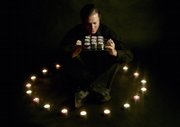 Andrew Loren Klamer, shown with his line of candles, began with Karma in a Can, and his company has since expanded. He says his products by themselves won&squot;t bring good karma: "It&squot;s more of an awareness, about living the clean lifestyle."