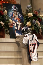 A portrait of slain Denver Broncos cornerback Darrent Williams and his jersey are displayed at his funeral service. The funeral was held Saturday in Fort Worth, Texas.