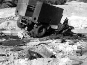 A photo contained in a U.S. Naval Criminal Investigative Service report obtained by the Washington Post shows damage from a roadside bomb on the morning of Nov. 19, 2005, near Haditha, Iraq. The blast shattered the front of one Humvee and sent it flying.