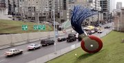 The 19-foot-tall "Typewriter Eraser, Scale X," by Claes Oldenburg and Coosje van Bruggen stands in view of traffic passing on nearby Elliott Avenue at the Seattle Art Museum's new sculpture park. The museum opened the art park on the downtown waterfront Saturday, bringing a free cultural experience to local residents and telling the world Seattle has something new worth noting.