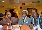 Gordon Parks, center, sits with his daughter, Toni, and son, David, at the opening for the "Half Past Autumn" exhibit at the Dallas Museum of Art. The photo was taken in June 2005, nine months before Gordon Parks died at age 93. David Parks will be in Lawrence Tuesday to speak about his father.