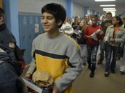 Dravid Joseph, a ninth-grader at West Junior High School, goes about his daily routine Monday at the school, 2700 Harvard Road. On Wednesday he will spend the day in Topeka with state Sen. Marci Francisco as part of Gifted and Talented Day, designed to bring attention to the state's high-performing students.