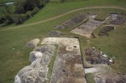 Archaeologist trenches reveal clay floors of Neolithic houses at Darrington Walls, England, occupied by the builders of Stonehenge. Each house was about 14 feet by 14 feet, and had a central hearth and remains of wooden box beds.