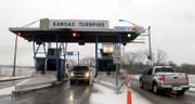 Gov. Kathleen Sebelius has proposed raising tolls on the Kansas Turnpike to help fund higher education needs, including maintenance on buildings. Vehicles passed through the East Lawrence tollbooth Wednesday.