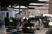 Members of the Massachusetts Bay Transit Authority Police, the Massachusetts State Police and the Boston Bomb Squad respond to a suspicious package found near the Sullivan Square subway station in Boston. Several additional suspicious devices were found Wednesday in different areas of the city. The devices proved to be hoaxes, part of a marketing campaign for the cartoon "Aqua Teen Hunger Force."