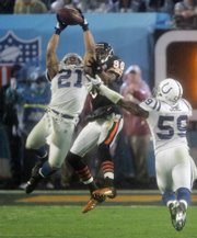 Indianapolis safety Bob Sanders (21) intercepts a pass in front of Chicago receiver Bernard Berrian (80). The Colts picked off the Bears twice in the fourth quarter to seal the victory.