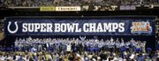 Members of the Indianapolis Colts react to the crowd during a rally in Indianapolis. The team was honored Monday, a day after it beat the Bears in Super Bowl XLI.