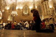 A pregnant young woman attends a mass at Lisbon's 16th century Jeronimos Monastery church. Members of pro-life movements attended the mass that closed their campaign ahead of Sunday's national referendum on whether to legalize abortion scheduled. The referendum in Portugal failed because voter turnout was below 50 percent.