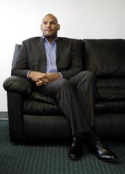 Former NBA player John Amaechi has been overwhelmed by media coverage since becoming the first NBA player to acknowledge his homosexuality. His memoir, "Man in the Middle," will be released Wednesday.