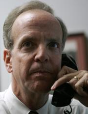 U.S. Rep. Jerry Moran, R- Kan., talks on the phone with constituents in his Capital Hill office Monday, Jan. 29, 2007 in Washington. Moran is taking advantage of a new technology that allows him to talk to thousands of people on a single phone call.