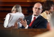 Rep. Jeff Whitham, R-Garden City, holds up a stack of more than 2,000 signatures from Kansans who want Alexa's Law to be approved. The bill is named after Baby Alexa, an unborn child who died as the result of her mother's murder.