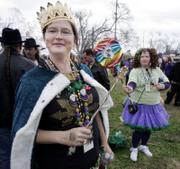 Julie Kelly, queen of the Krewe of Dreaux, left, and her sister Lisa Kelly get ready for the start of their parade Saturday in New Orleans. The parade moves through the Gentilly section of the city that was flooded by Hurricane Katrina.
