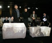 Simcha Jacobovici, standing at left, an investigative journalist, director, producer and writer, points to an ossuary - a small casket to store bones - he and others say once may have held the remains of Mary Magdalene. The ossuary at right may have held the remains of Jesus of Nazareth, Jacobovici said during a news conference Monday in New York. James Cameron, middle, produced a new documentary that says 10 ancient ossuaries discovered in 1980 in a suburb of Jerusalem may have contained the bones of Jesus and his family. Also pictured are Charles Pellegrino, second from right, and Andrey Feuerverger, far right.
